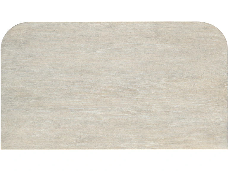Beige three-drawer dresser with metallic handles on a white background