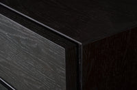 Black dresser with multiple drawers