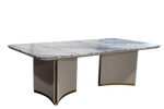 Marble-top dining table with wicker sides on a white background