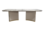 Marble-top dining table with curved base on a white background