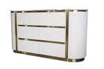 Modern white reception desk with gold accents on a white background