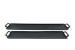 Two black griddle pans on a white background