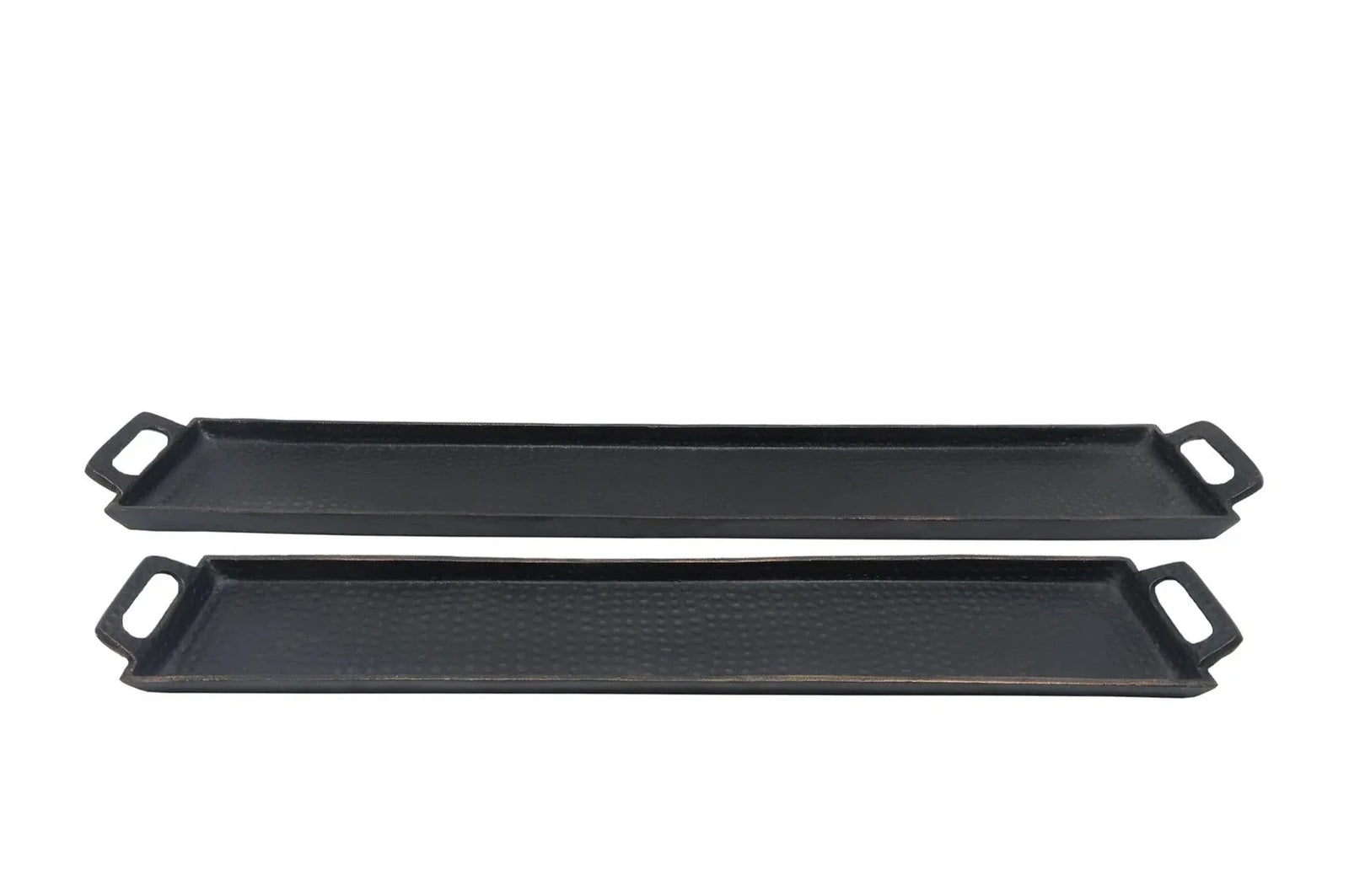Two black griddle pans on a white background
