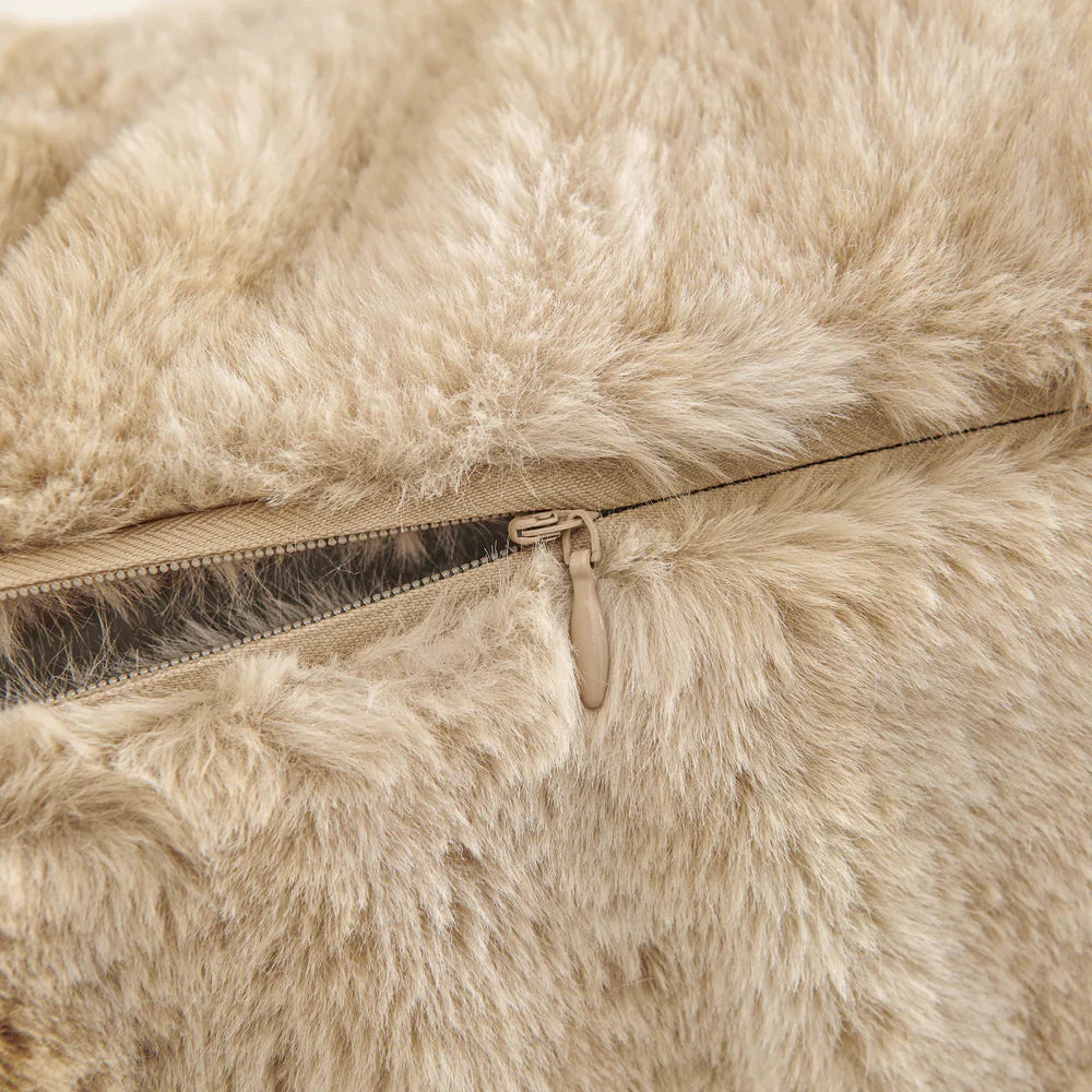 Close-up of a beige fur jacket with a zipper