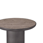 Round wooden table with a dark metal base on a white background