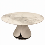 Round marble dining table with a metallic base on a white background