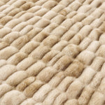 Close-up of a textured beige carpet