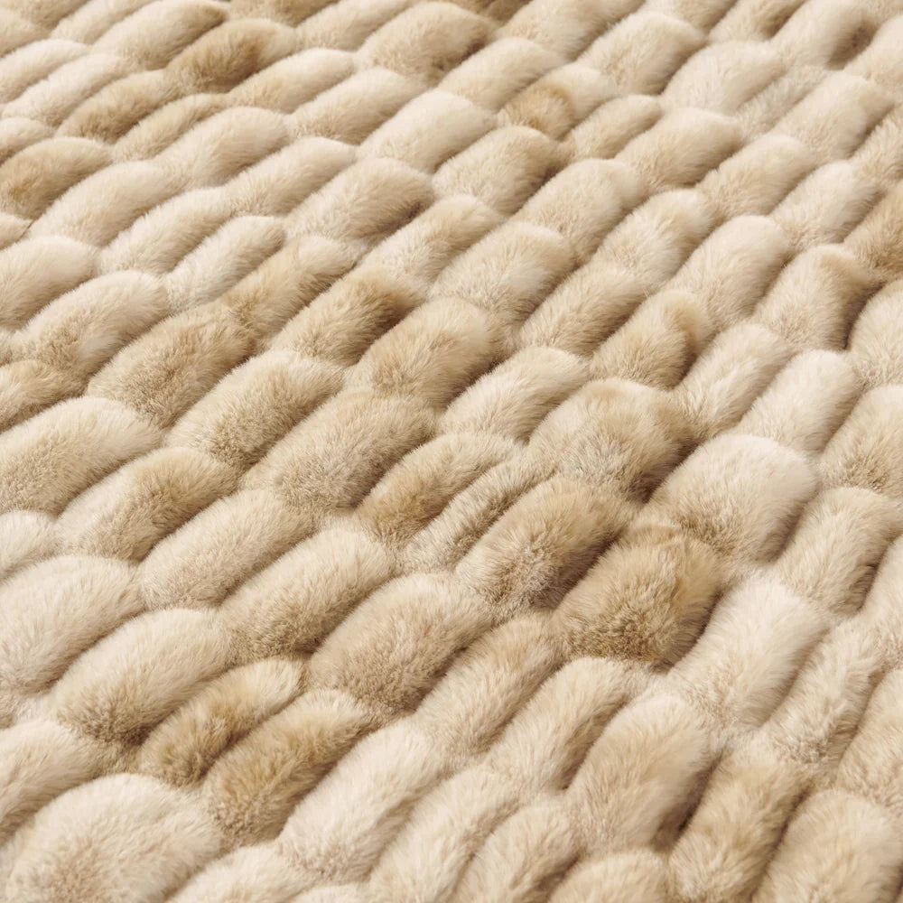 Close-up of a textured beige carpet