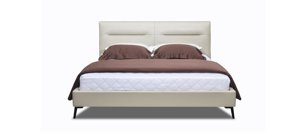 A beige upholstered headboard bed with brown leather-like fabric on the headboard and a white mattress.