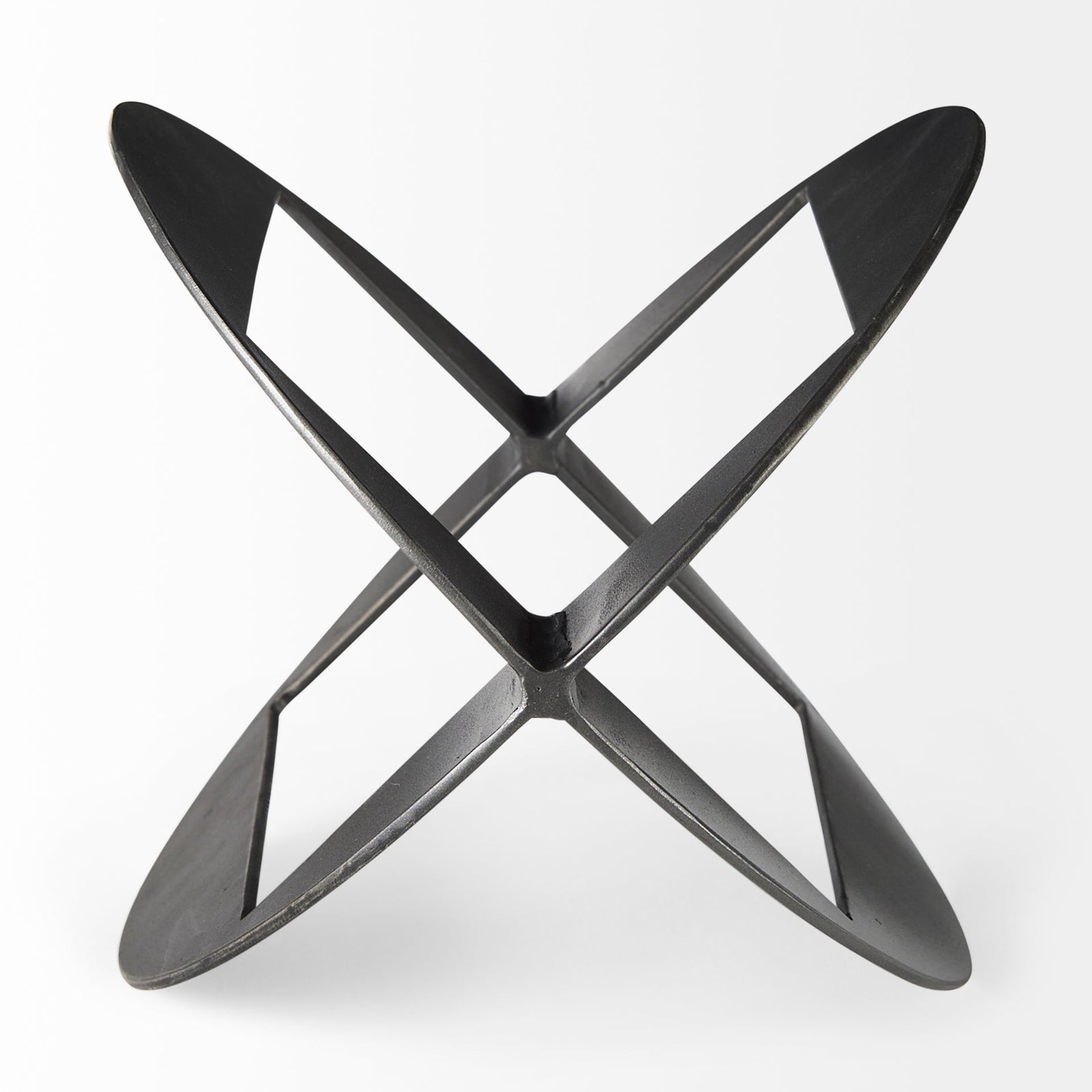 A round, black metal decorative object with a geometric design.
