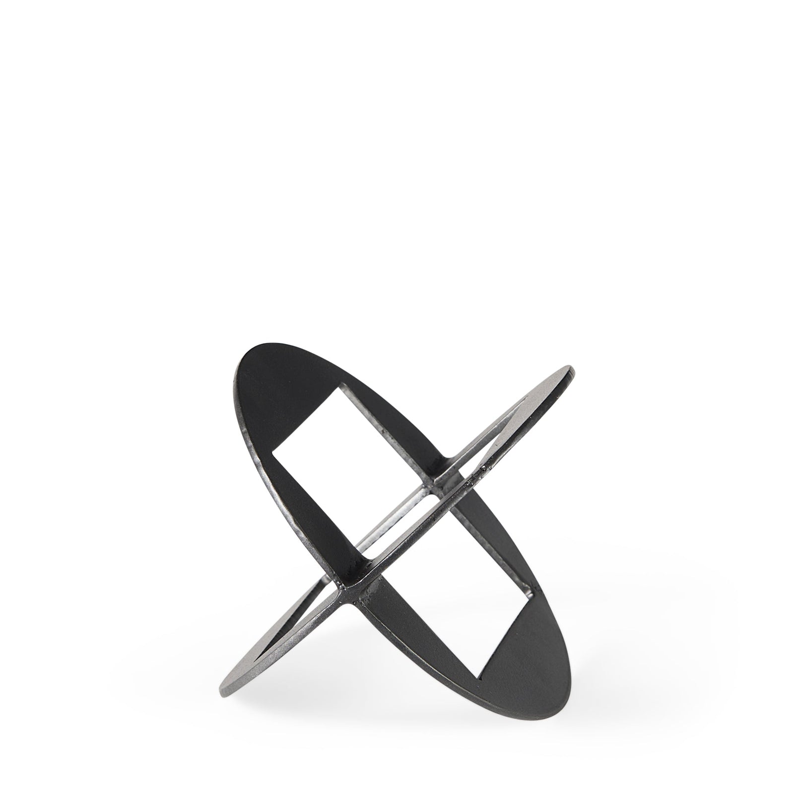 A round, black metal decorative object with a geometric design.