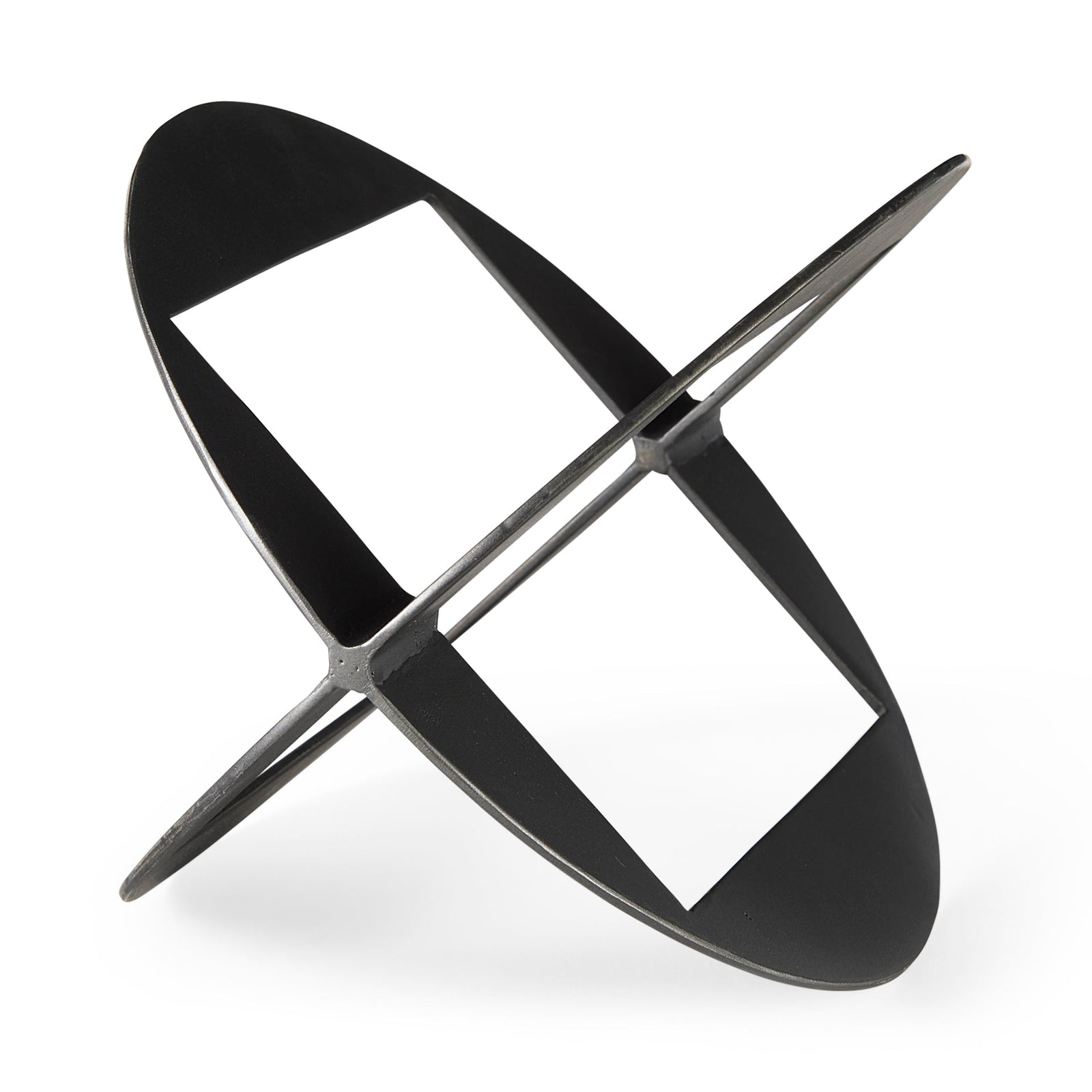 A round, black metal decorative object with a geometric design.