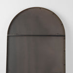 The back of a  full-length mirror with gold finished on a white background