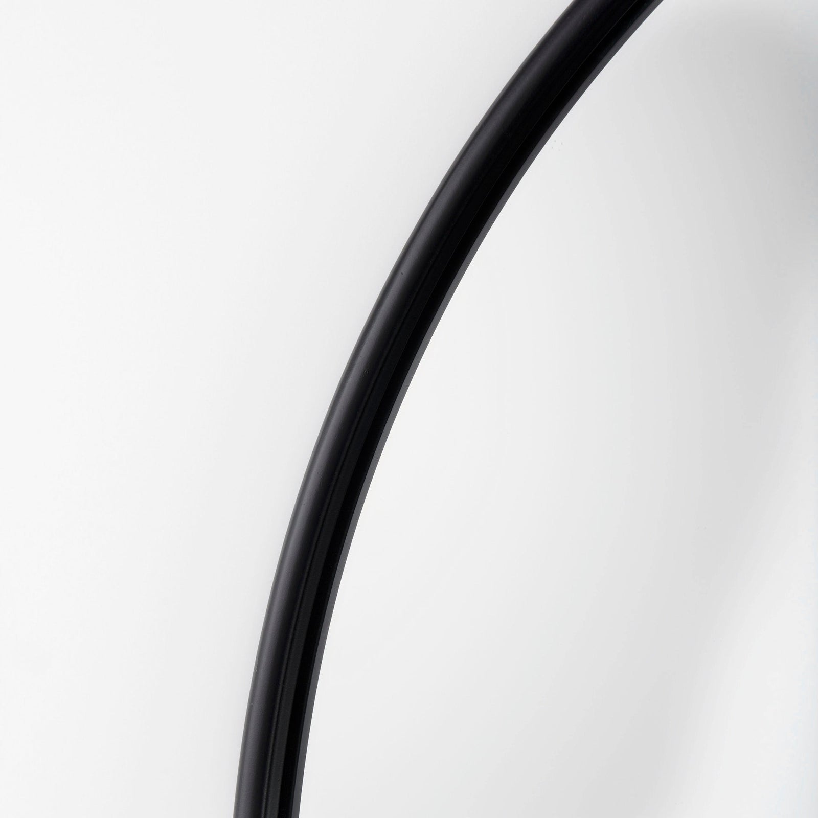 Close up to a full-length mirror with black finished on a white background