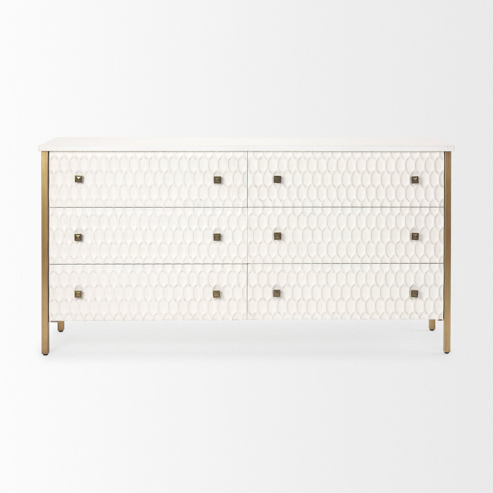 A white wooden sideboard with a geometric pattern on the front, featuring bronze-colored handles and legs.