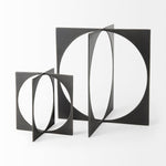 Bronze decorative object with geometric design on a white background