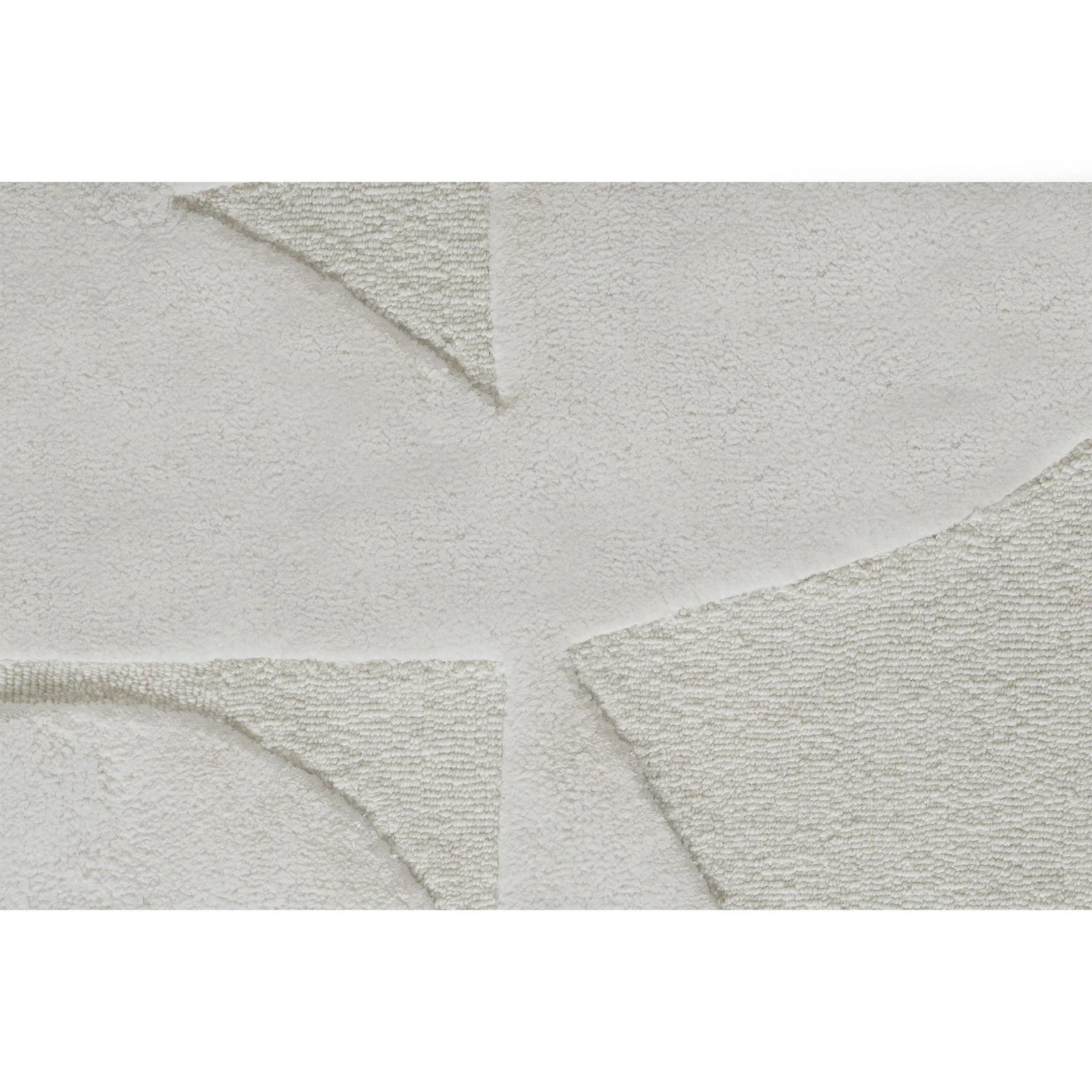 Close-up of a textured gray rug with geometric patterns