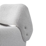 Close-up of a textured gray chair armrest on a white background