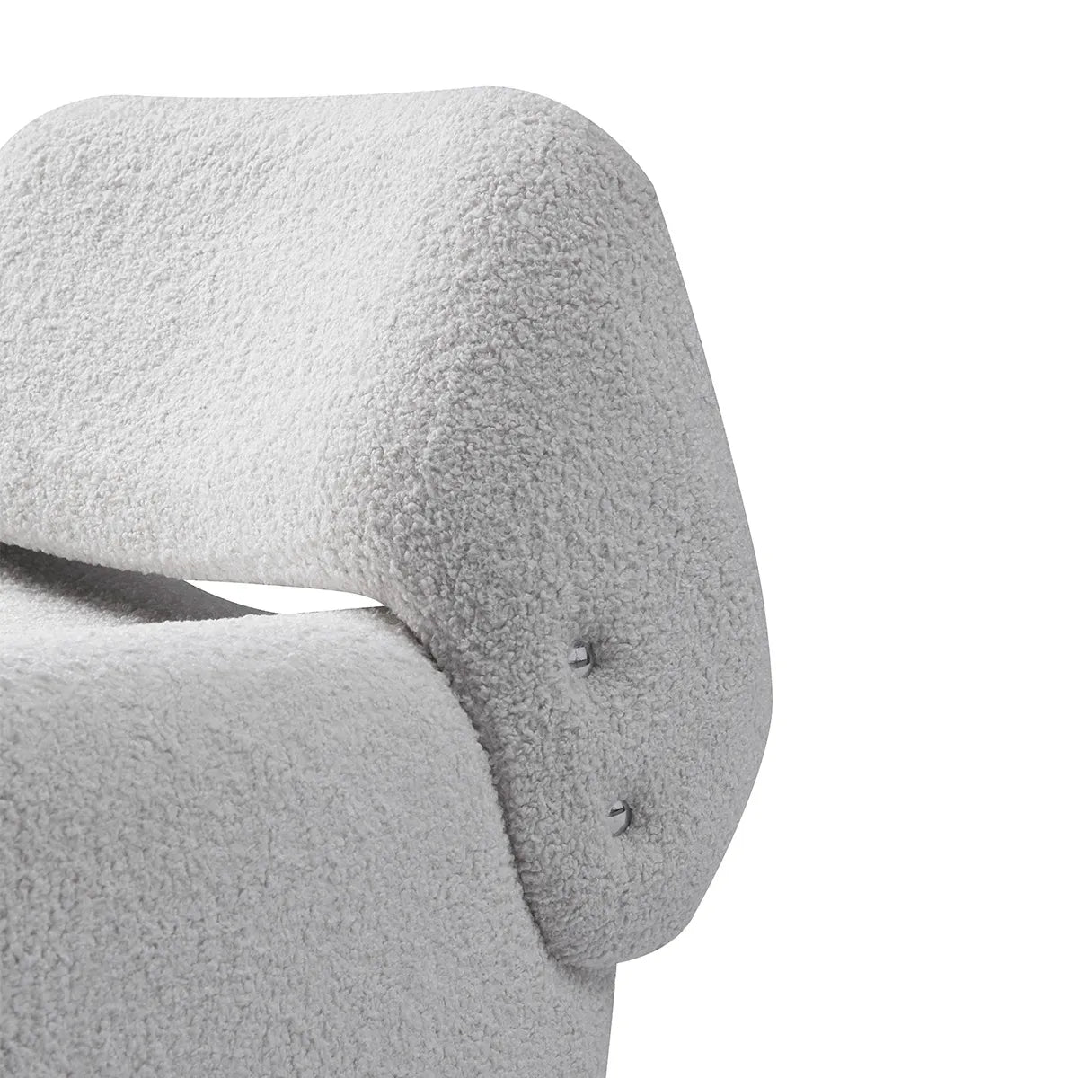 Close-up of a textured gray chair armrest on a white background