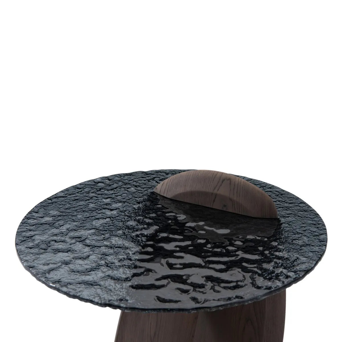 Round black marble table with a brown leather top on a white background