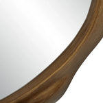 Close-up of a wooden circular mirror with a white background