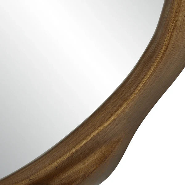 Close-up of a wooden circular mirror with a white background