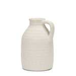 White textured ceramic pitcher on a white background