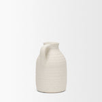 White ceramic pitcher on a white background
