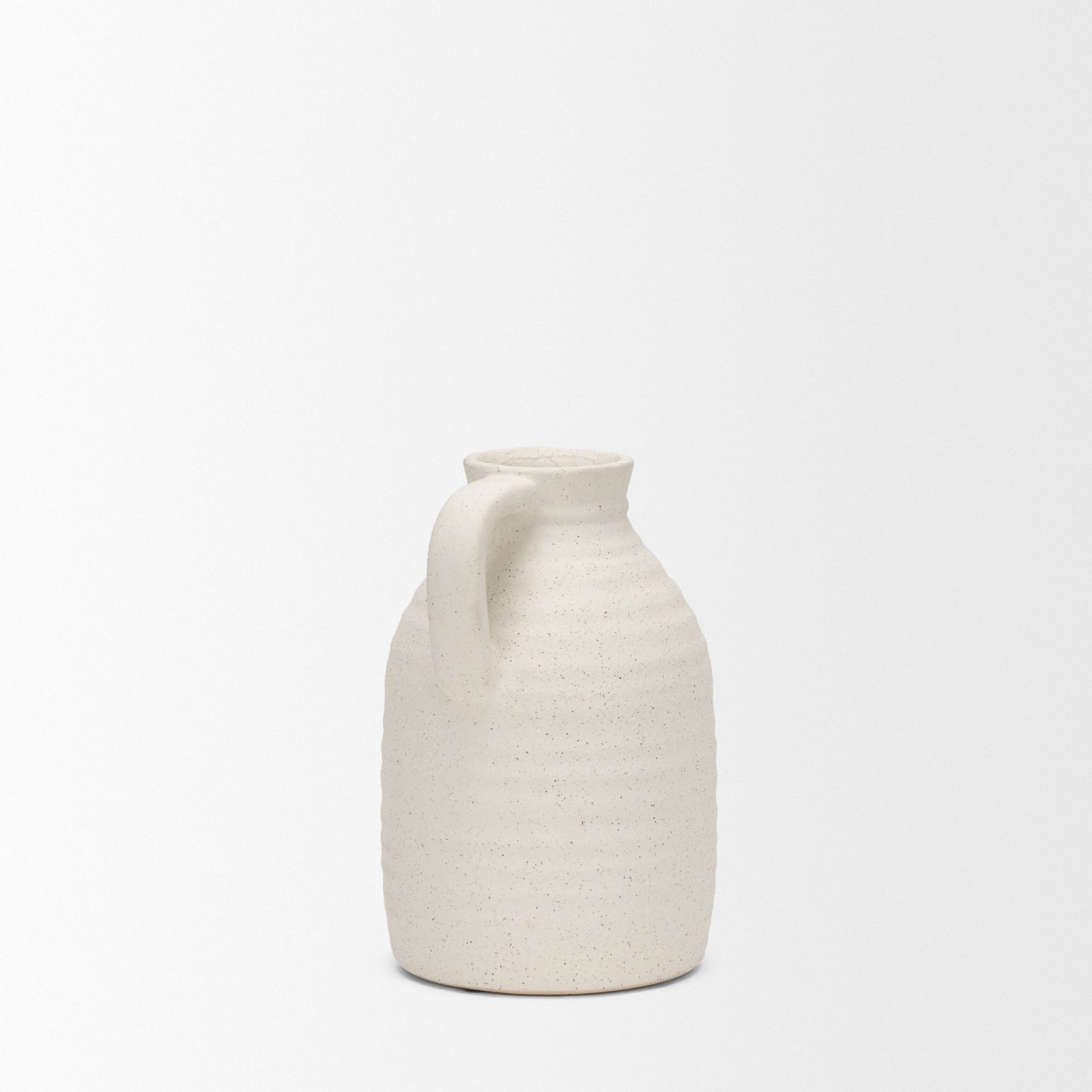White ceramic pitcher on a white background