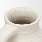Close-up of a textured ceramic vase on a white background