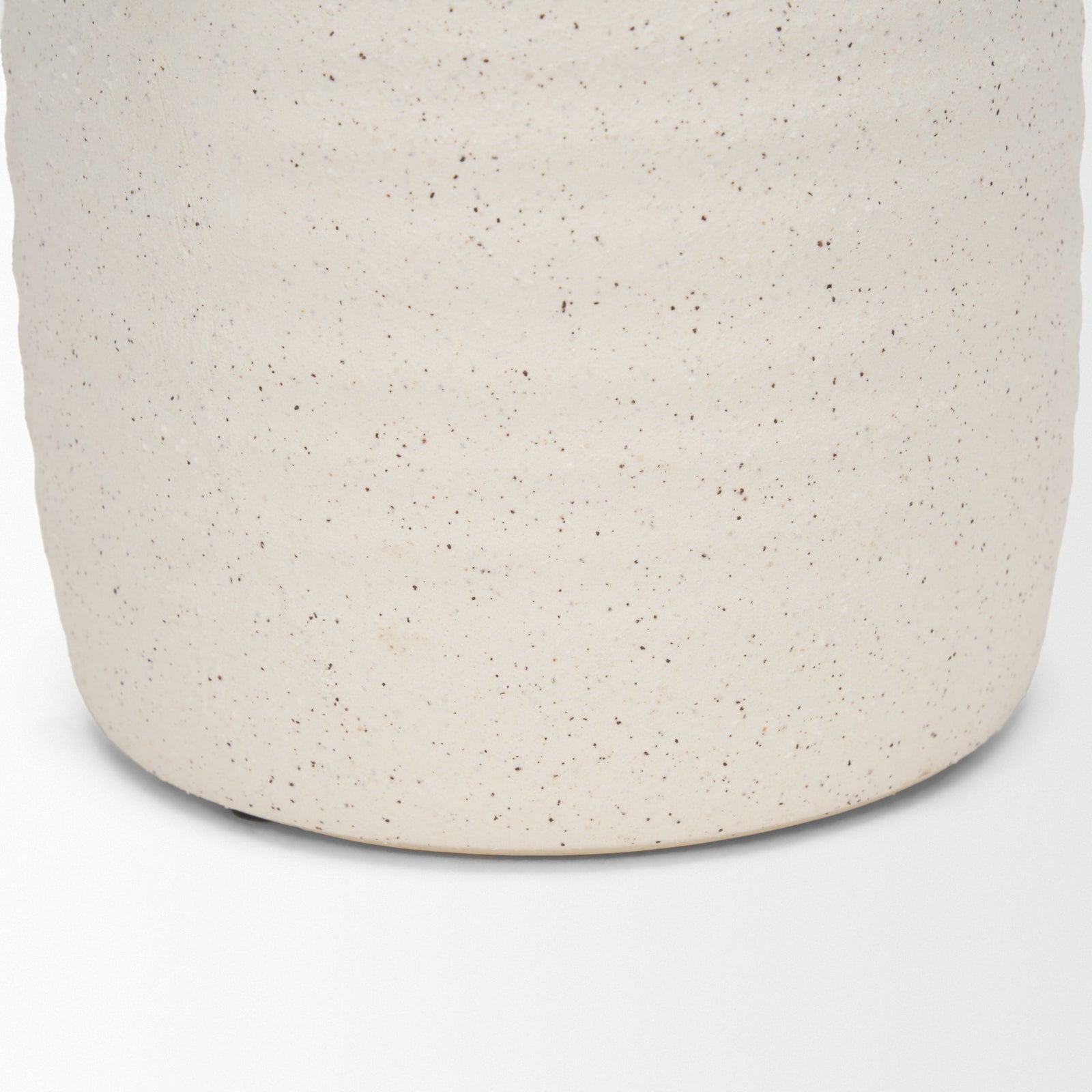 Close-up of a textured beige container on a white background