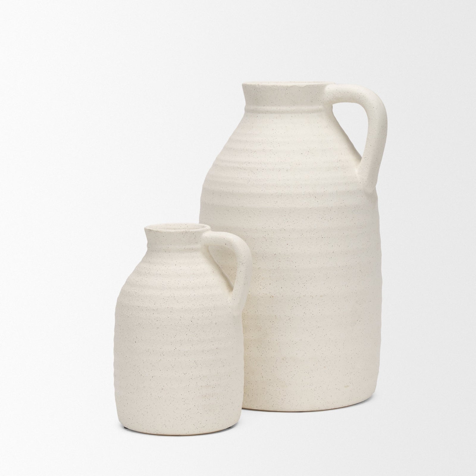 Two ceramic jugs on a white background