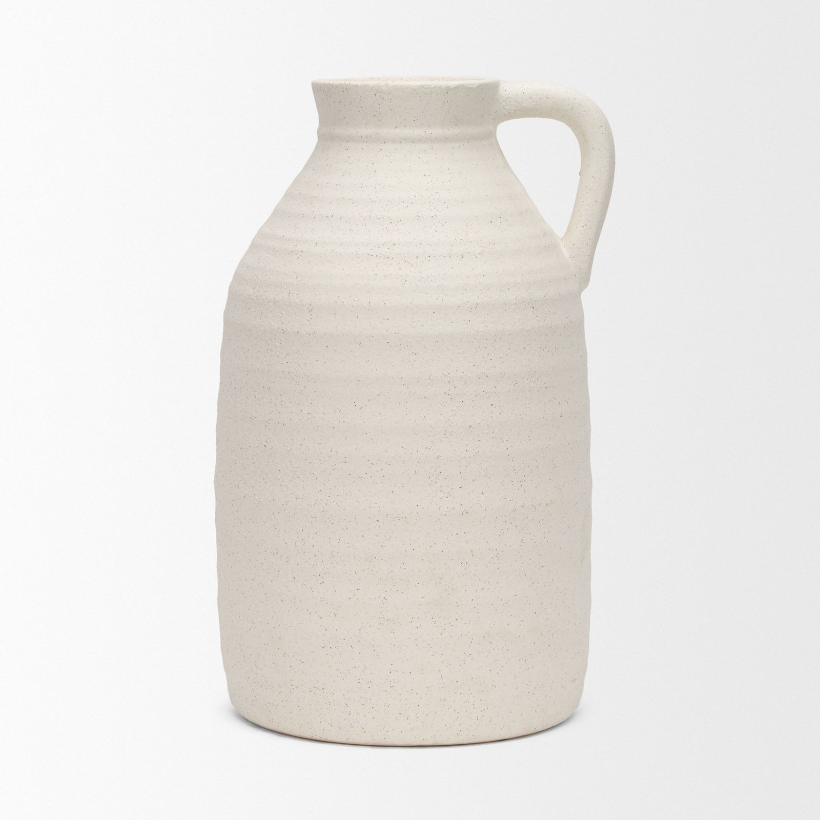 White ceramic pitcher on a light gray background