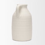 White ceramic pitcher on a white background