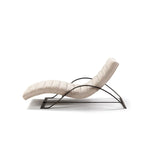 Modern lounge chair with curved design on a white background