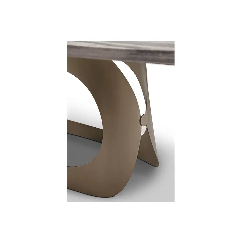 Modern coffee table with marble top and bronze base on a white background