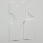 Abstract white sculpture on a light gray background
