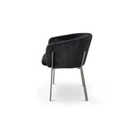 Black armchair with metal legs on a white background