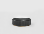 Round black marble table on a white background