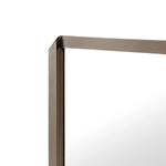 Rectangular mirror with a bronze frame on a white background