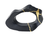Black ceramic dish with gold裂纹设计 on a white background