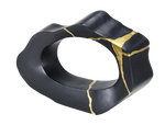 A black and gold decorative statue with a smooth finish and geometric shape.