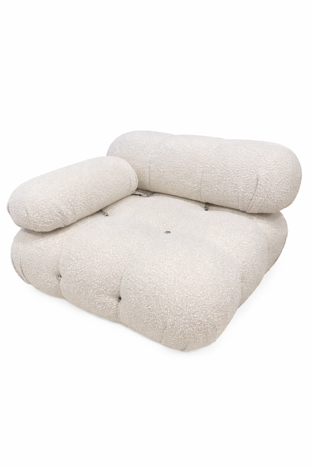 Beige cushion with quilted texture on a white background