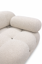 Close-up of a textured beige sofa on a white background