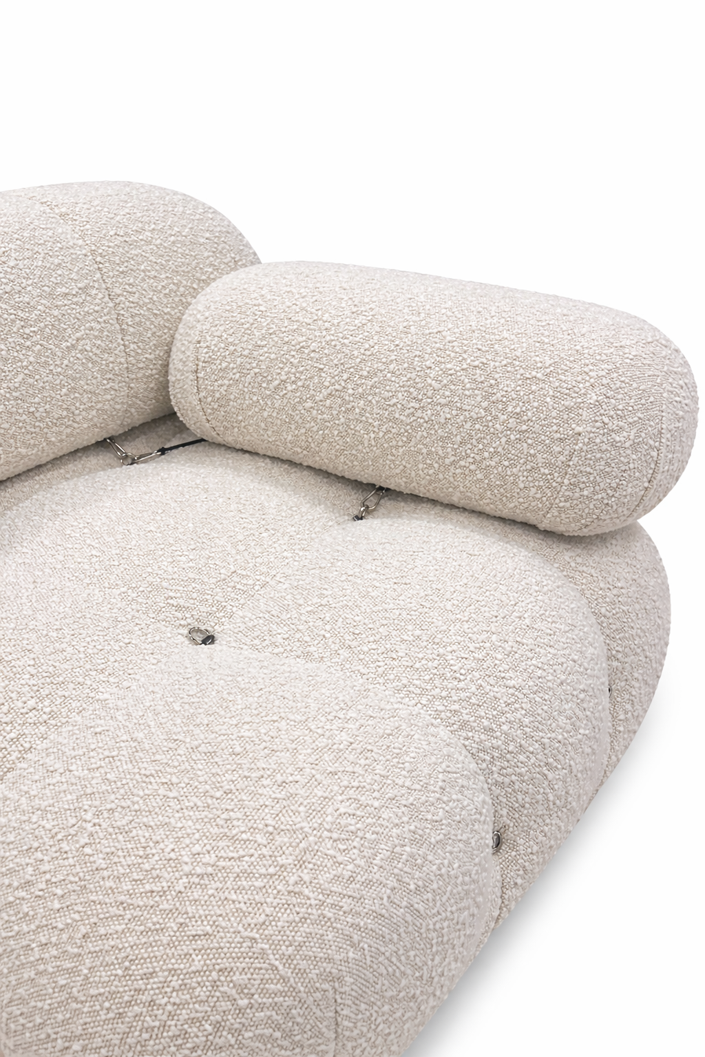 Close-up of a textured beige sofa on a white background