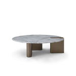 Modern coffee table with marble top and bronze base on a white background