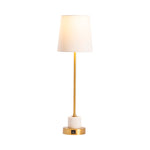 A brass marble table lamp with a white shade, gold metal stem, and a white marble base.
