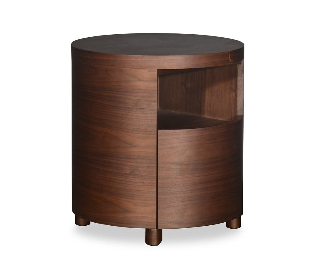 Wooden side table with a round top and curved sides on a white background