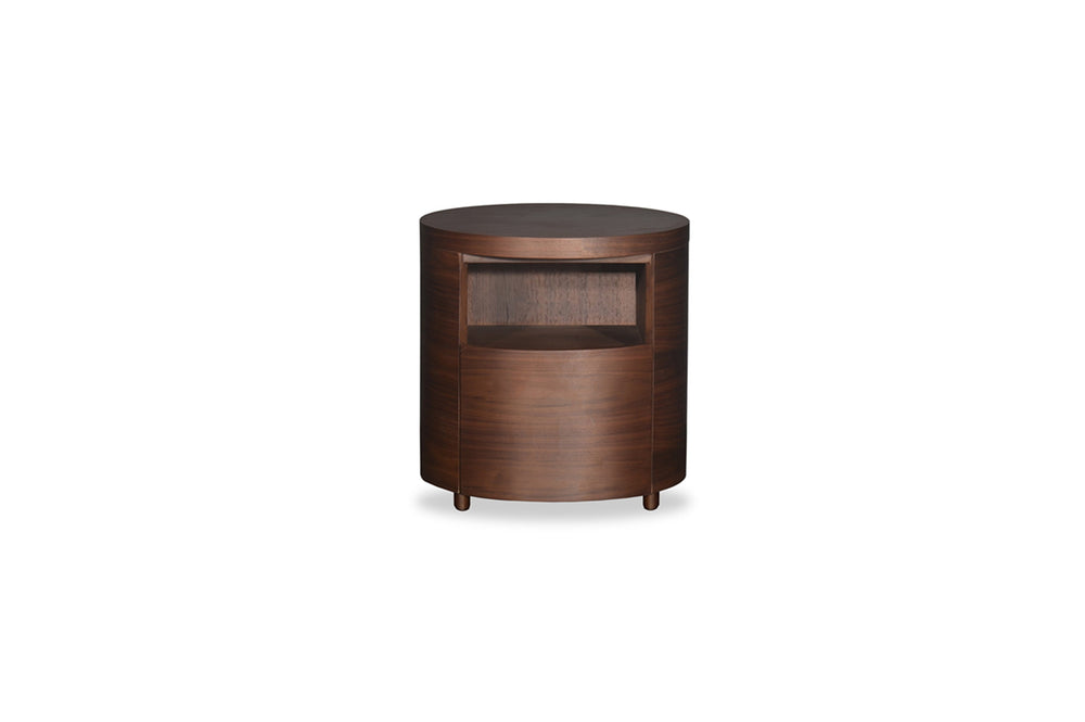 Wooden side table with a round top and curved sides on a white background