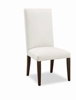 White chair with dark wood legs on a white background
